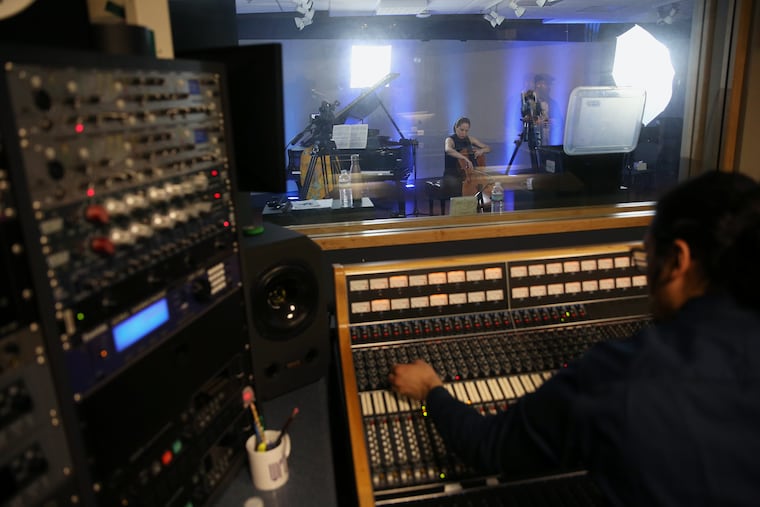 Live from WRTI: production assistant Paul Marchesani at the mixing board as cellist Christine Lamprea and pianist Navah Perlman rehearse.