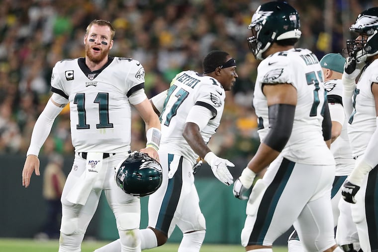 Eagles quarterback Carson Wentz (left) and wide receiver Alshon Jeffery are coming off a huge win at Green Bay. They are laying two touchdowns this week to the winless Jets.