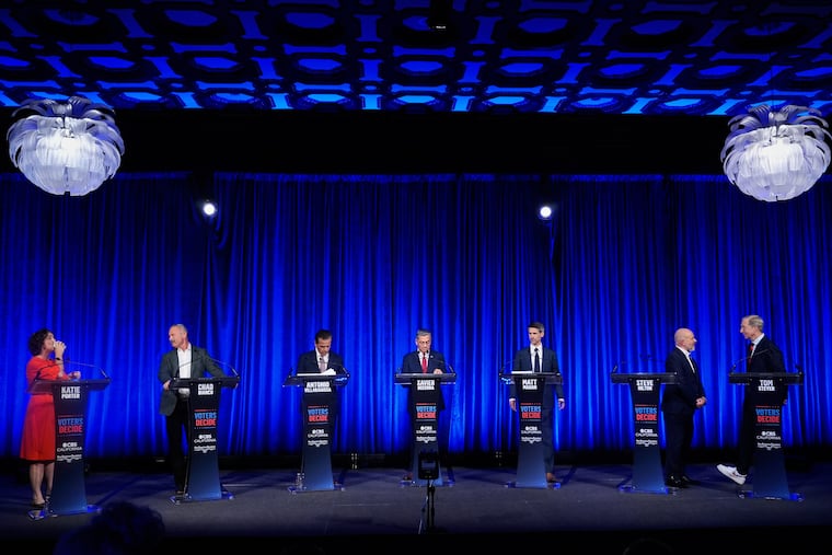 From left, Katie Porter, Chad Bianco, Antonio Villaraigosa, Xavier Becerra, Matt Mahan, Steve Hilton, and Tom Steyer wait during a break at a California gubernatorial debate hosted by CBS Bay Area and the San Francisco Examiner in San Francisco, Thursday, May 14, 2026.