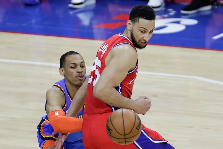 Sixers guard Ben Simmons stealing the ball from Oklahoma City Thunder forward Darius Bazley (left) on Monday.