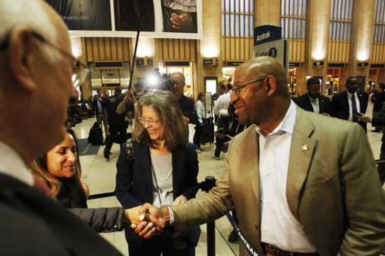 Philadelphia Mayor Michael Nutter greets passengers at 30th Street Station as train service resumes after last week's deadly derailment. (Alejandro A. Alvarez / staff)