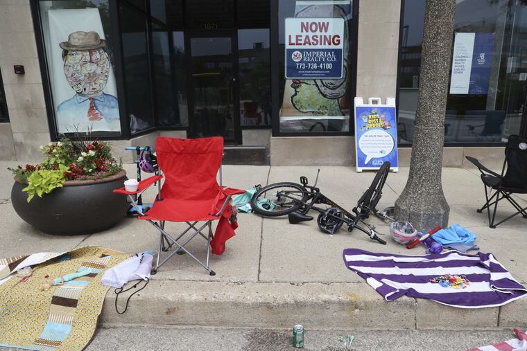 Chairs, bottles of water and other belongings left by people fleeing St. John Avenue, near the scene of the shooting in Highland Park, Ill., on Monday.