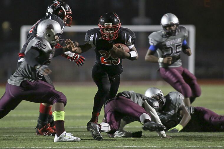 Northeast's Amir Paulk (25) runs the ball during their
Public League Class AAA quarterfinals football game against Northeast, Tuesday Nov. 3, 2015, in Northeast Philadelphia. Northeast defeated Bartram 40-18.