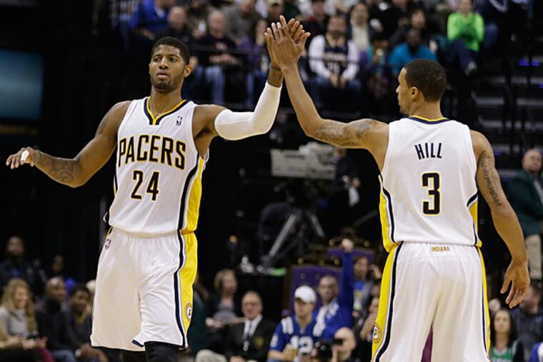 The Pacers' Paul George (24) in action with George Hill (3). (Darron Cummings/AP file)