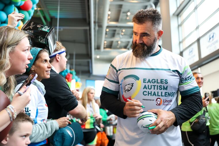 Jason Kelce signs autographs during the Eagles Autism Challenge event on Saturday.