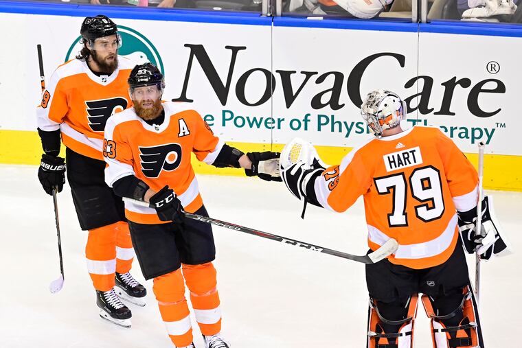 Flyers winger Jake Voracek (93) congratulates goaltender Carter Hart (79) in Game 1. Voracek could play on any of the top three lines Sunday night in Game 3.