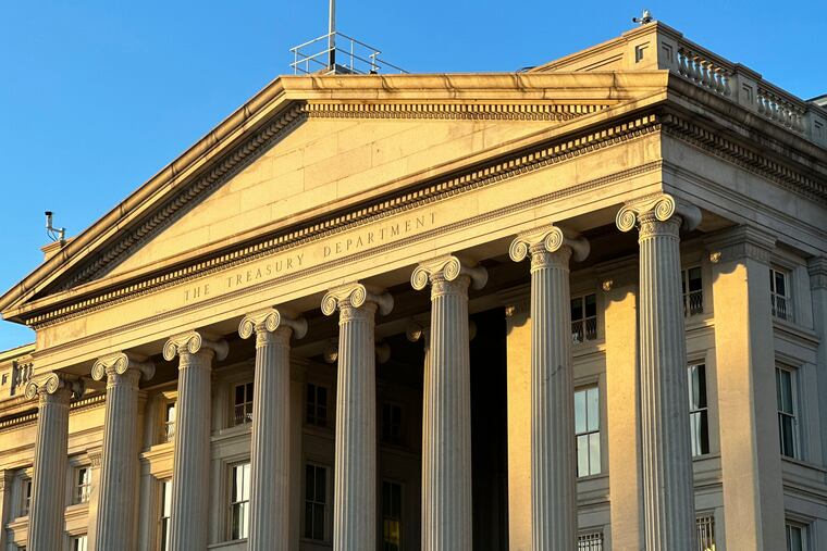 The Treasury Department is seen near sunset in Washington, Wednesday, Jan. 18, 2023. The Treasury Department projects that the federal government on Thursday will reach its legal borrowing capacity, an artificially imposed cap that lawmakers have increased roughly 80 times since the 1960s. Markets so far remain calm, as the government can temporarily rely on accounting tweaks to stay open.