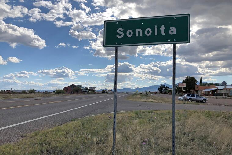 In this photo taken Monday, May 13, 2019, a sign for Sonoita stands in the heart of southeastern Arizona where owners of wineries and other small tourism operations worry that the Rosemont Copper Mine proposed to be built in the nearby Santa Rita Mountains could harm their businesses with mining trucks rumbling down scenic state highway 83 that runs past the range. Native American tribes are seeking an injunction to halt work on the copper mine project they say will desecrate burial and other sacred sites in the Santa Rita Mountains of southeastern Arizona. (AP Photo/Anita Snow)
