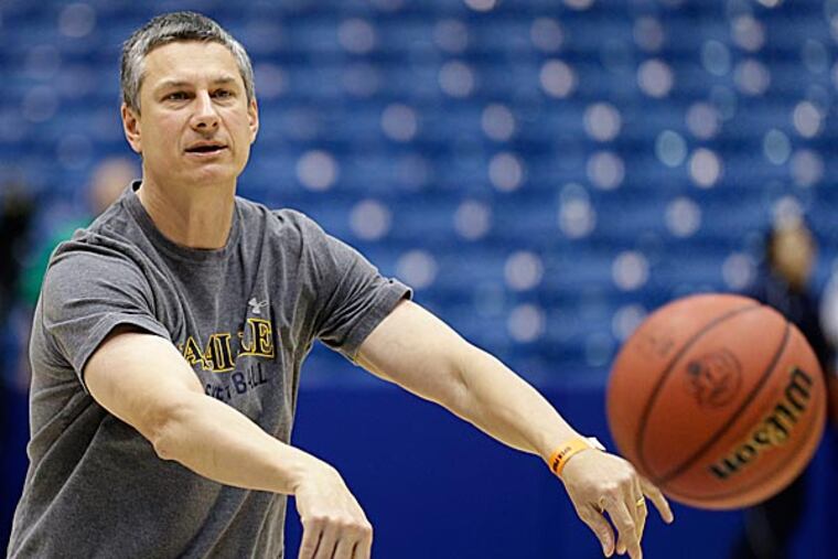 Nothing is given, it must be earned. La Salle head coach John Giannini learned that early. (Al Behrman/AP)