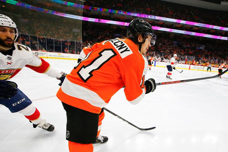 Travis Konecny gets the puck out of his defensive zone and past Florida's Vincent Trocheck during the second period of Monday's win over Florida.