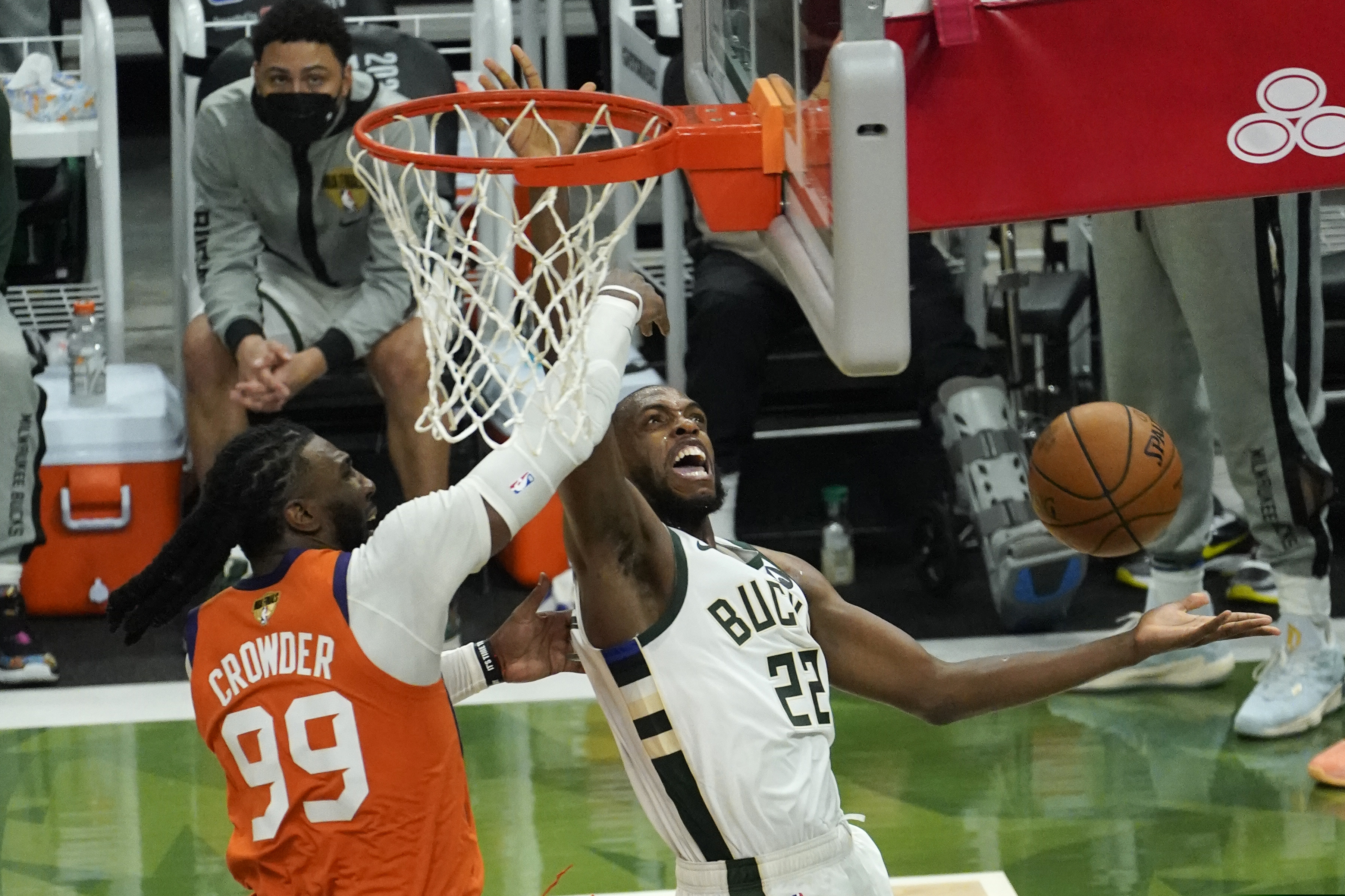 Milwaukee Bucks forward Khris Middleton drives around Phoenix Suns forward Jae Crowder during the second half of Game 4.