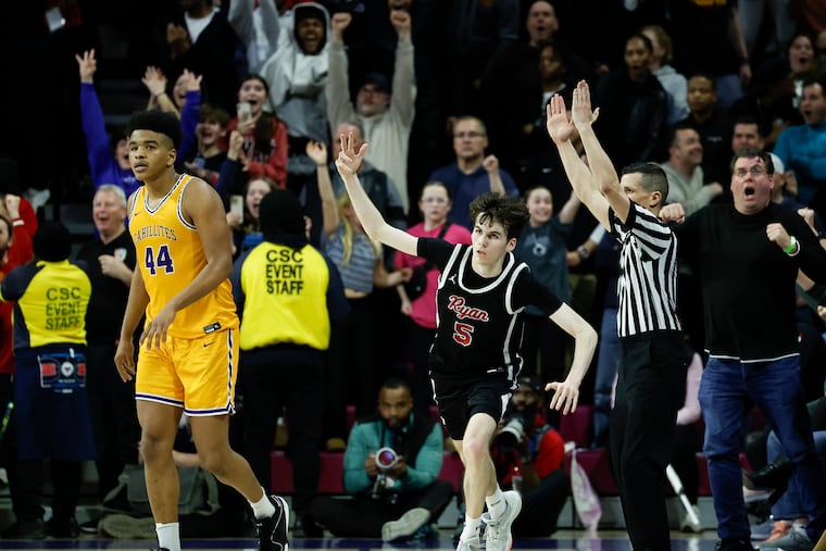 Archbishop Ryan’s Ryan Everett (center) celebrates after making a late overtime three-point basket past Roman Catholic’s Shareef Jackson (left) during the Philadelphia Catholic League boys’ basketball championship game at the Palestra on Feb. 26.