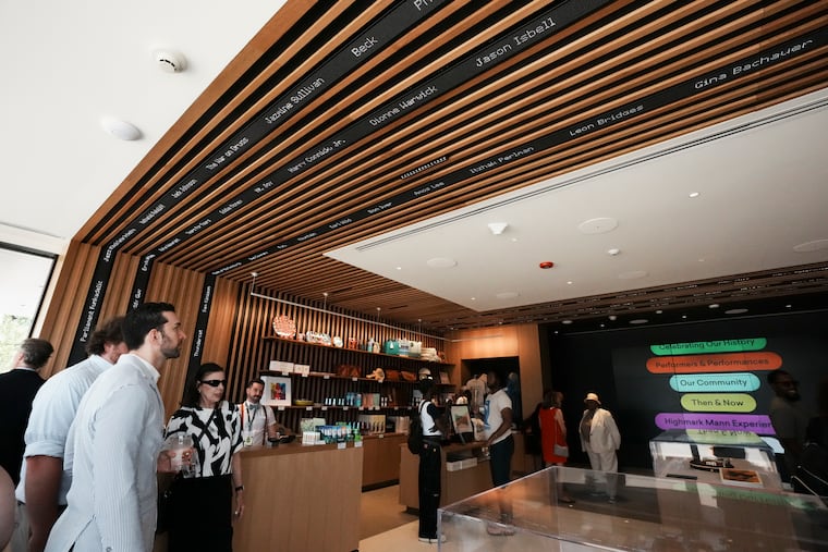 The welcome center at the Highmark Mann includes a gift shop, interactive panels with games testing musical trivia, and tickers flashing the names of artists who have performed at the outdoor arts center.