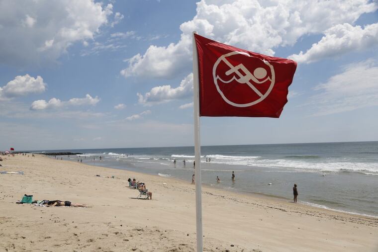 A "no swimming" sign is seen in Asbury Park, N.J.