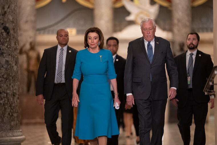 Speaker of the House Nancy Pelosi, D-Calif., and Majority Leader Steny Hoyer, D-Md., arrive to make a statement ahead of a planned late-night vote on the coronavirus aid package deal at the Capitol in Washington in March.