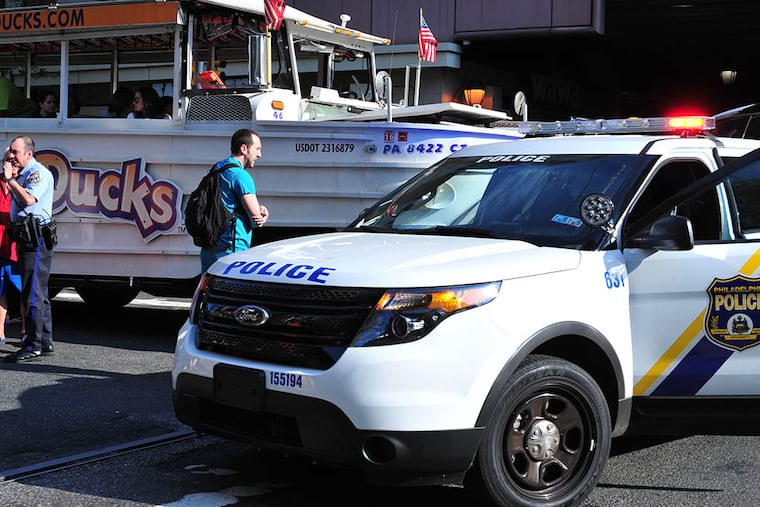 Police investigating an accident in which a woman was struck by a duck boat near the Pennsylvania Convention Center on May 8, 2015. ( Jessie Fox / Philly.com )