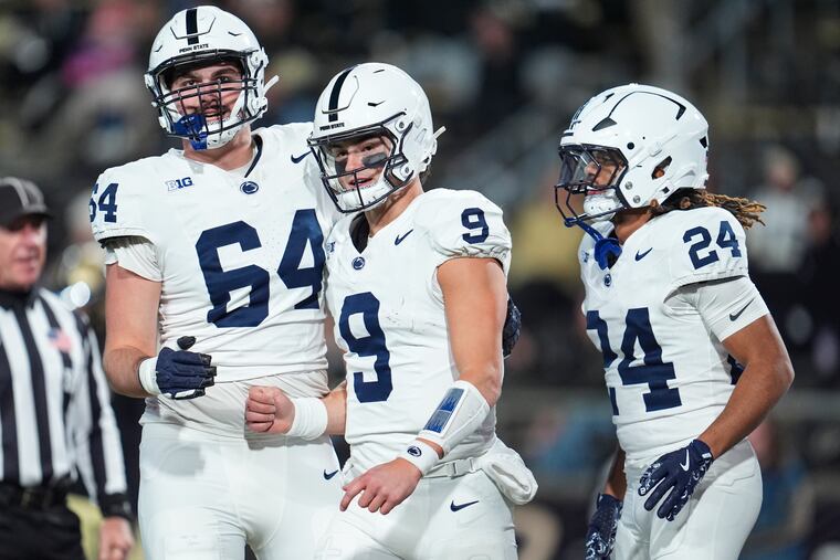 Penn State quarterback Beau Pribula (9) celebrates with offensive lineman Eagan Boyer (64) and running back Corey Smith (24) after a touchdown that fueled a rout of Purdue in West Lafayette, Ind., on Saturday.