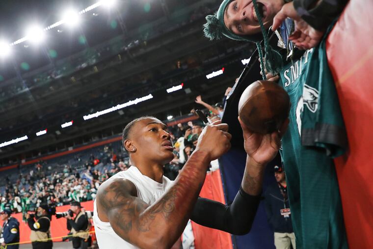 Eagles fans sing happy birthday and get autographs from Philadelphia Eagles wide receiver DeVonta Smith (6) following an Eagles win over the Denver Broncos a game at Empower Field at Mile High in Denver, Co. on Sunday, Nov. 14, 2021. Eagles won, 30-13.