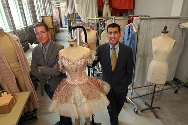 Roy Kaiser, Pennsylvania Ballet Artistic Director, left, and Executive Director Michael Scolamiero, right, in the costume shop on North Broad Street. ( MICHAEL BRYANT / Staff Photographer )