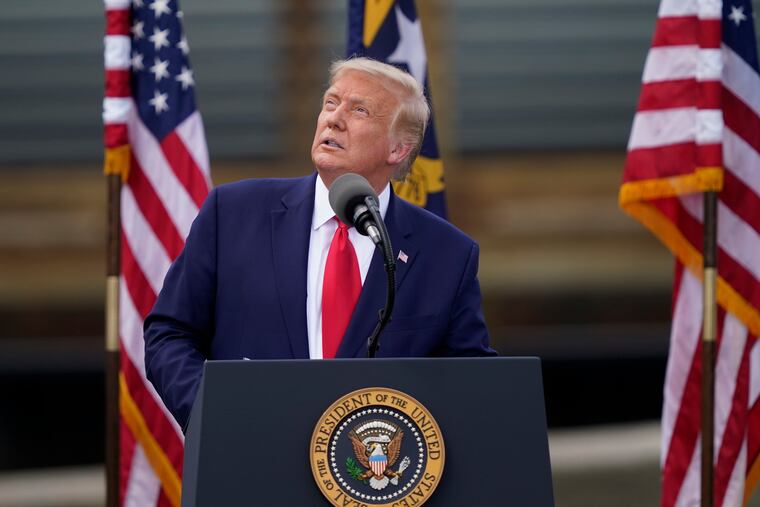President Donald Trump speaks during a speech on Wednesday, Sept. 2, 2020, in Wilmington, N.C., as the U.S.S. Battleship North Carolina is seen behind.
