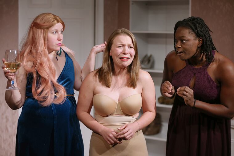 From left, Grayce Hoffman plays Julie, Sara Vanasse plays Bridget, and Taiwo Sokan plays Taylor during a rehearsal for "Marry, Marry, Quite Contrary" at the Plays and Players Theatre in Philadelphia on Wednesday, Jan. 22, 2020. The show, a true crime twist on "The Bachelor," is a production of the feminist theater group Paper Doll Ensemble.