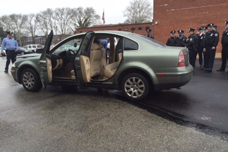 A car with a specially rigged back seat used by alleged dealer to store drugs.