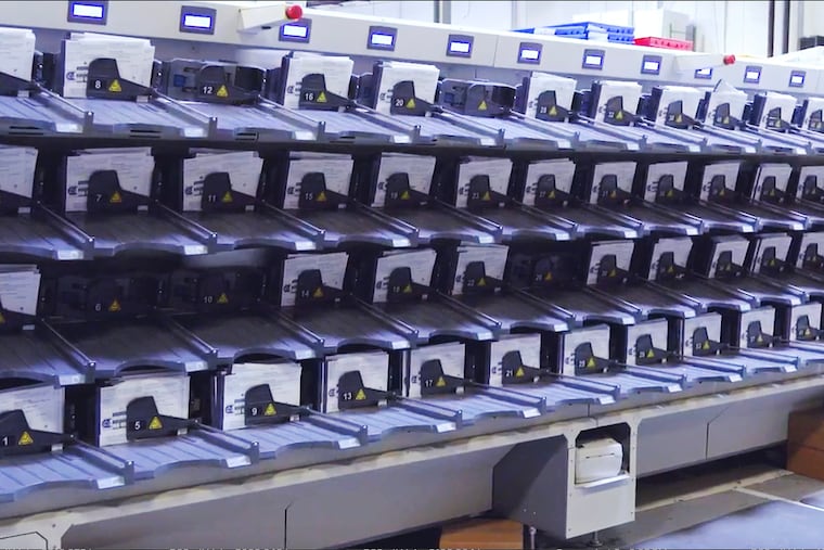 A demonstration of a ballot-sorting machine used to count mail-in votes in Philadelphia.
