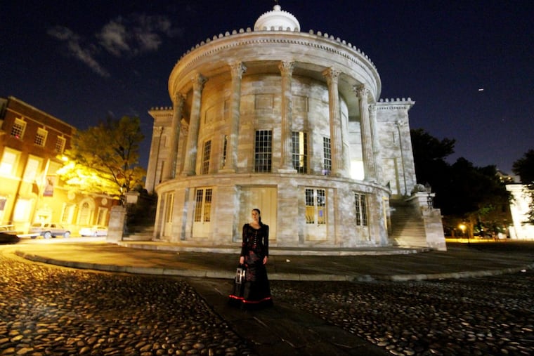 Ghost Tour of Philadelphia guide Kate Quinn in front of Merchants’ Exchange.