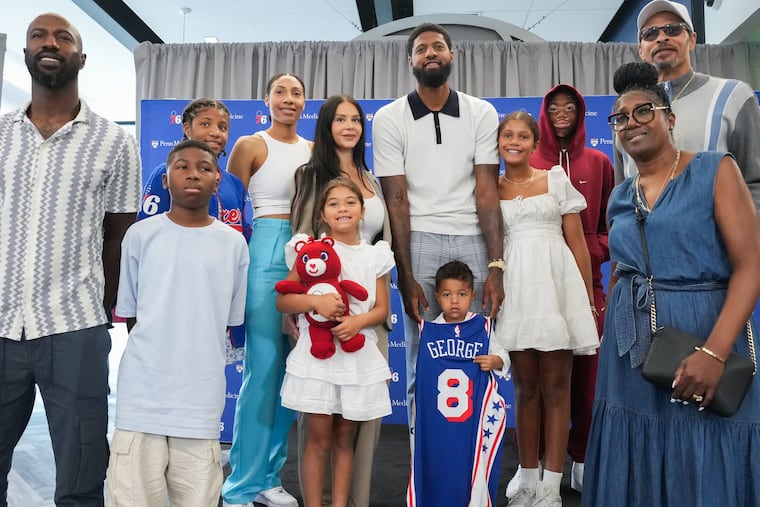 Paul George (center) was recently joined by his dad, Paul George Sr. (far right) on his podcast.