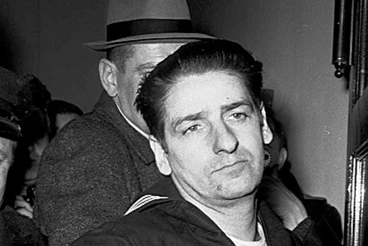 FILE - This Feb. 25, 1967, file photo shows self-confessed Boston Strangler Albert DeSalvo minutes after his capture in Boston. DeSalvo confessed to the string of 1960s killings but was never convicted. He died in prison in the 1970s. Massachusetts officials said Thursday, July 11, 2013, that DNA technology led to a breakthrough, putting them in a position to formally charge the Boston Strangler with the murder of Mary Sullivan, last of the slayings attributed to the Boston Strangler. (AP Photo, File)