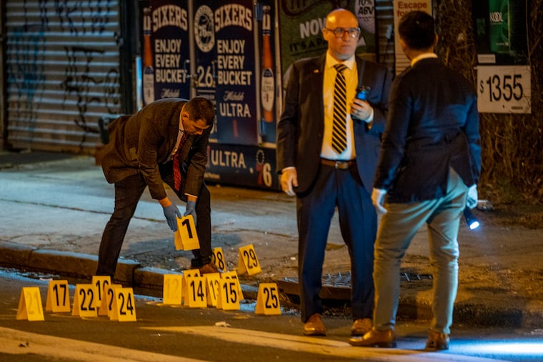 Police investigating the scene of a shooting on the northeast corner of 31st and Norris Streets on Thursday. The crime scene was about a half-block away from James G. Blaine School on the 3000 block of Norris.