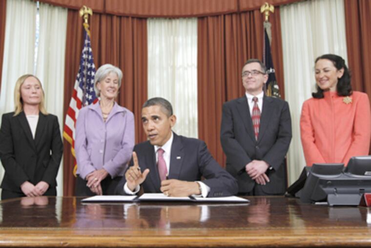 President Obama prepares to sign the executive order aimed at reducing drug shortages. With him Monday were (from left) Boston pharmacy manager Bonnie Frawley, Health and Human Services' Kathleen Sebelius, cancer patient Jay Cuetara, and FDA chief Margaret Hamburg. (Charles Dharapak / Associated Press)