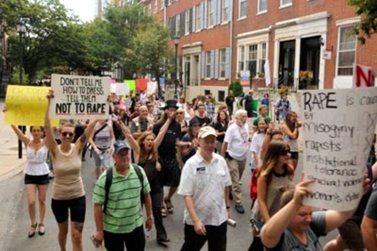 Dozens of people walk through Center City on Saturday in support of Philadelphia SlutWalk. (Ron Tarver / Staff Photographer)