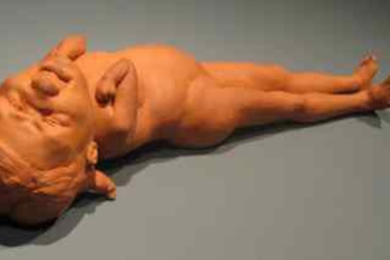 At the Mutter Museum: "Piggy," a terra-cotta sculpture by Anne Drew Potter of a recumbent figure that is half-child, half-adult.
