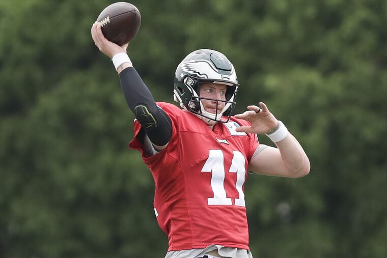 Eagles quarterback Carson Wentz throws the football during training camp at the NovaCare Complex in South Philadelphia on Saturday, July 28, 2018. YONG KIM / Staff Photographer