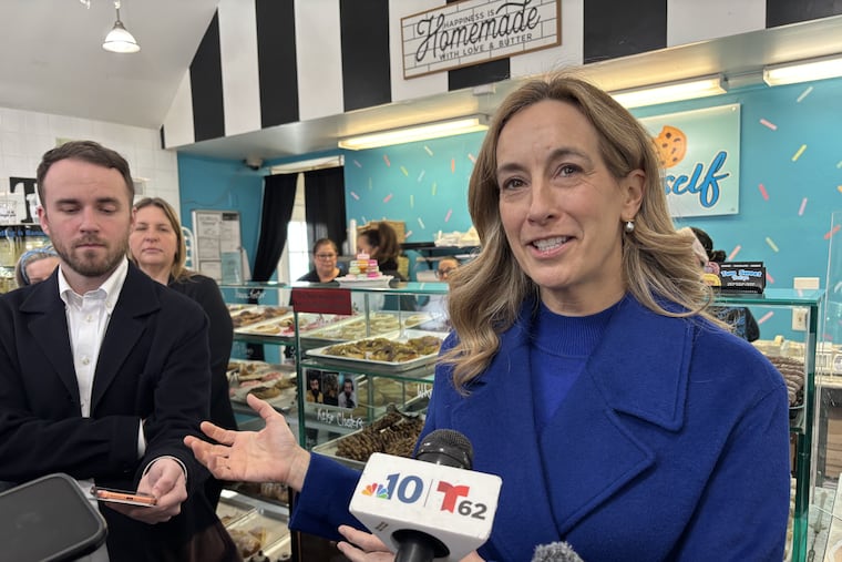 Gov. Mikie Sherrill speaks to reporters at Two Sweet Boutique in Deptford, N.J., on Friday.