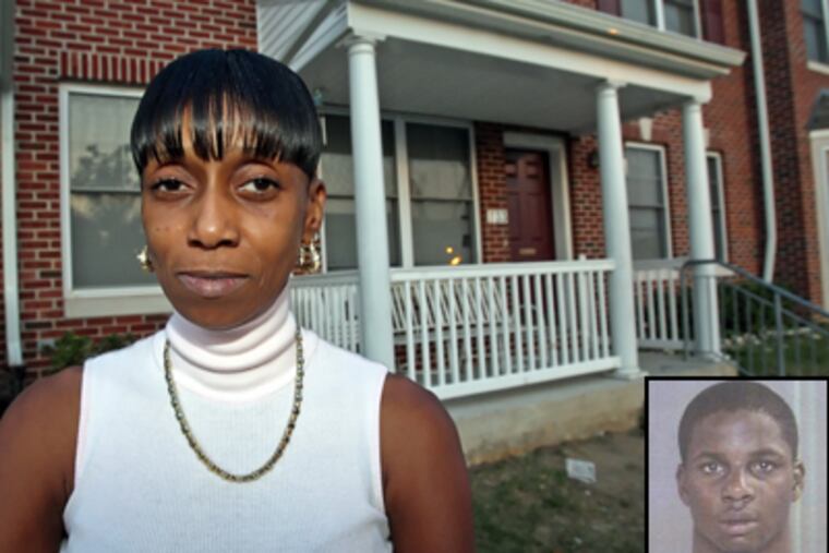 Neighbor Barbara George says suspect Andre Butler (inset), who lived in the house over her shoulder, was 'a menace to the neighborhood.' (Steven M. Falk / Daily News)