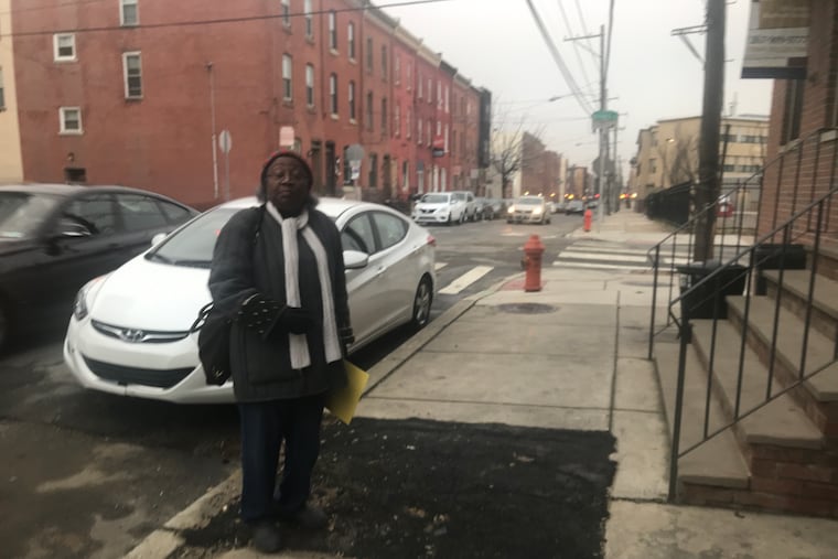 Jackie Wiggins, a retired teacher who now conducts tours of historic sites, stands at the spot where the marker for Jessie Redmon Fauset was installed in 1993.