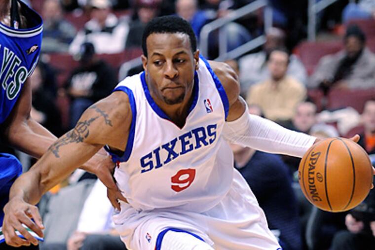 Philadelphia 76ers guard Andre Iguodala (9) drives past Minnesota Timberwolves forward Ryan Gomes. (AP Photo/Michael Perez)