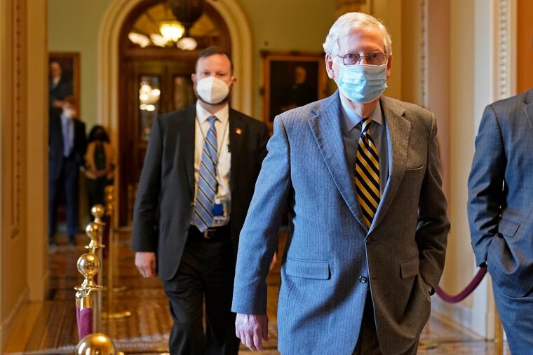Senate Majority Leader Mitch McConnell of Ky., walks back to his office on Capitol Hill in Washington, Wednesday, Dec. 30, 2020.