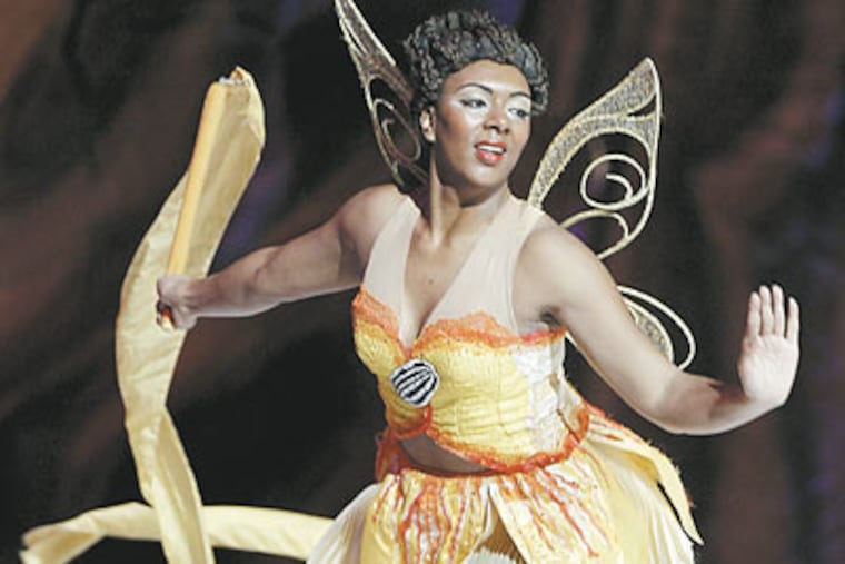 Ice work if you can get it: 22-year-old Stephanie Hilton, put on a fast track after a Disney performer was injured, skates as Tinker Bell's friend Iridessa in "Worlds of Fantasy" at the Wachovia Center. (Akira Suwa / Staff Photographer)