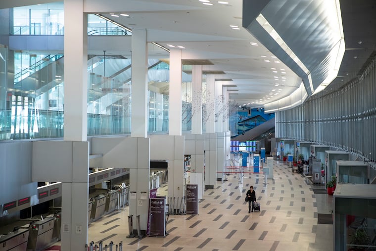 A mostly empty international check-in area at the Philadelphia International Airport on March 16.