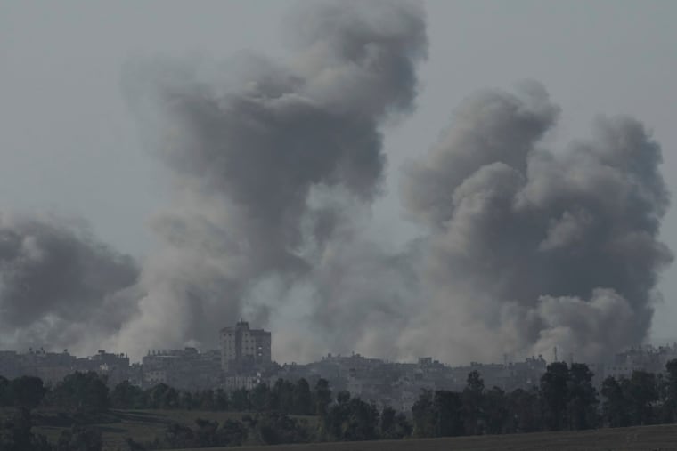 Smoke rises following an Israeli bombardment in the Gaza Strip, as seen from southern Israel on Tuesday, Dec. 26, 2023.