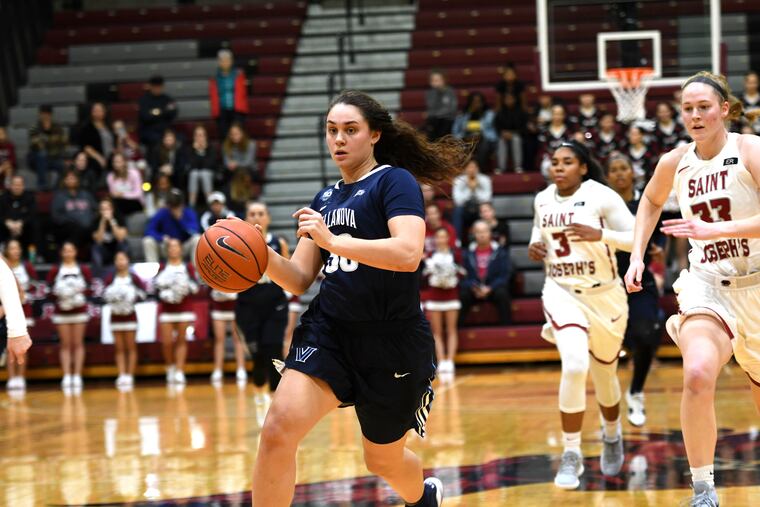 Mary Gedaka dribbles to basket in a game against Saint Joseph's.