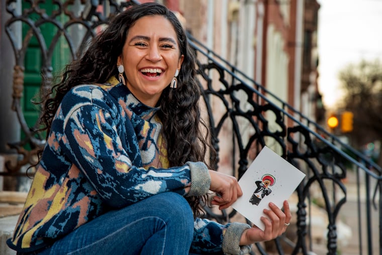 Carmen Aranda with one of her ¡Feliz Mariachi! greeting cards.