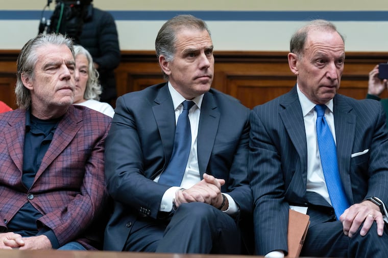 Hunter Biden, President Joe Biden's son, center, accompanied by his attorney Abbe Lowell, right, sit in the front row at a House Oversight Committee hearing as Republicans are taking the first step toward holding him in contempt of Congress on Wednesday on Capitol Hill in Washington.