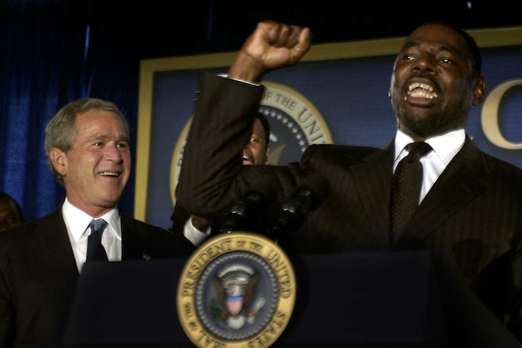 Pastor Herb Lusk with former President George W. Bush years ago.