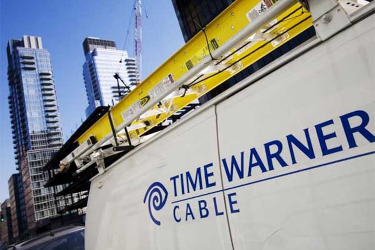 FILE - In this Feb. 2, 2009 file photo, a Time Warner Cable truck is parked in New York. (AP Photo/Mark Lennihan, file)
