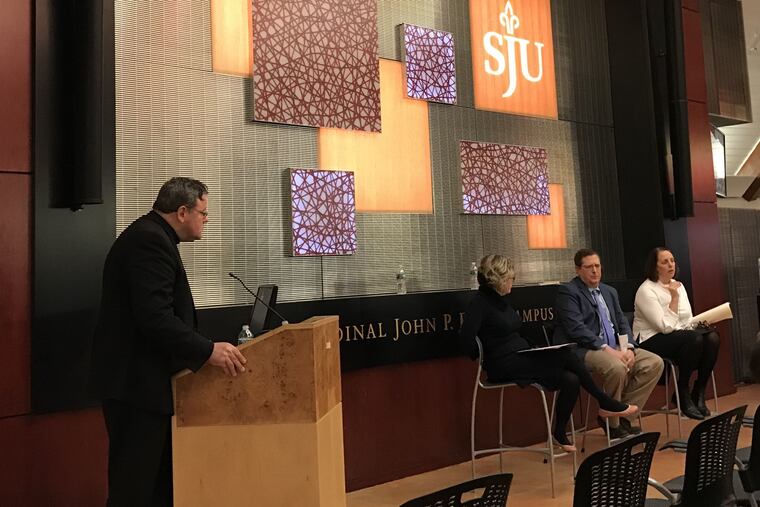 The Rev. Dan Joyce, left, of St. Joseph's University, moderates a panel discussion about the Pennsylvania grand jury report into clergy abuse on Wednesday, February 6, 2019. Also present were (L to R) Kathleen Sparrows Cummings of Notre Dame University, Philadelphia attorney Henry Hockheimer, and Main Line trauma therapist Cara Tripodi.