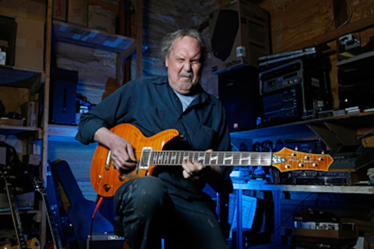 For master mechanic/musician Charlie Pierson, it's all about fine cars and guitars. (Michael Bryant/Staff)